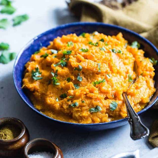 Coconut Curry Mashed Sweet Potatoes - A sweet and spicy spin on a holiday classic!  So creamy you will never believe they are dairy, grain and gluten free and paleo/vegan/whole30 compliant! | Foodfaithfitness.com | @FoodFaithFit