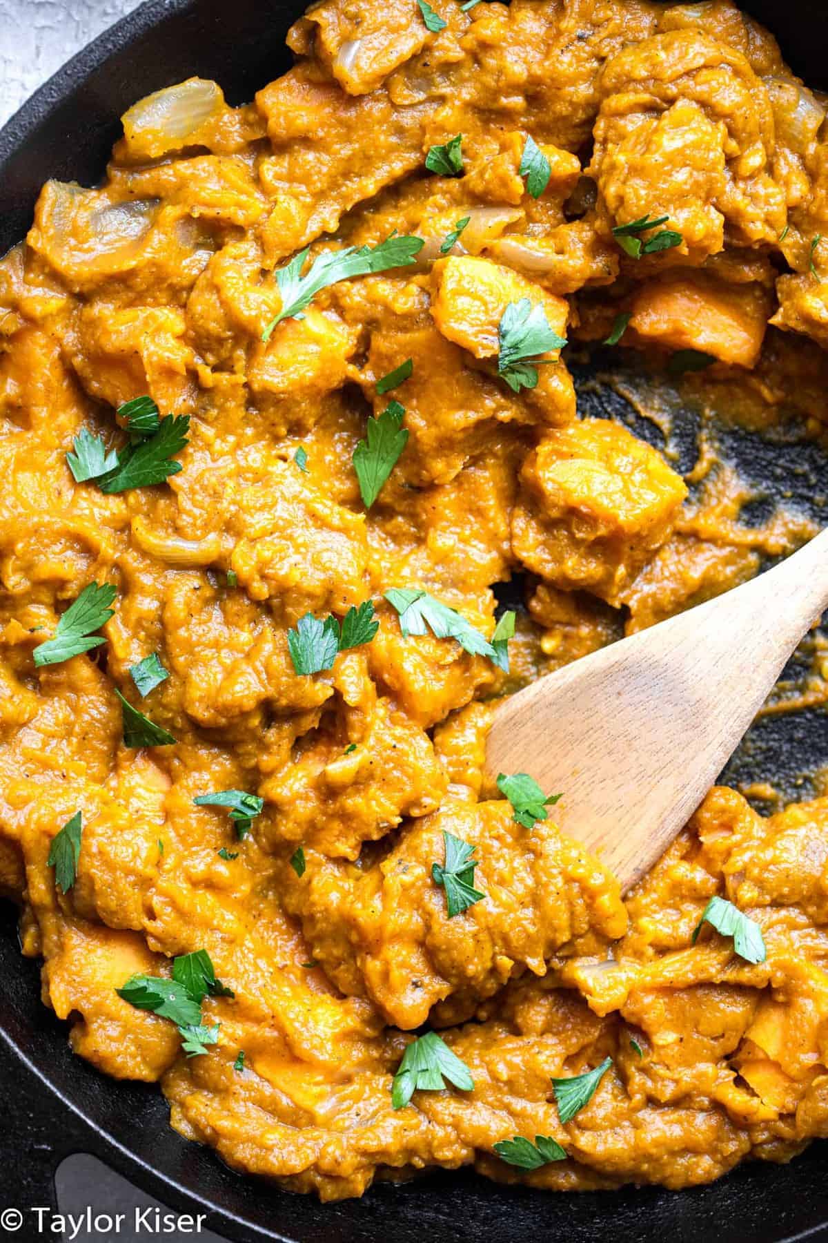 Life Changing Vegan Pumpkin Curry - My husband said this was the best curry he ever had! An easy, 30 minute meal that is naturally gluten free, paleo, whole30 and healthy too! A must make for fall! | #Foodfaithfitness | #glutenfree #paleo #whole30 #vegan #healthy Vegan pumpkin curry in a pan