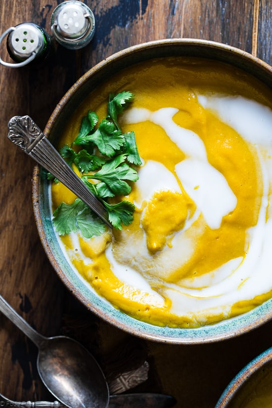 Coconut Curry Roasted Butternut Squash Soup - This spicy, paleo and vegan butternut squash soup is so creamy you'll never believe it's healthy, whole30 compliant and gluten and dairy free! | #Foodfaithfitness | #paleo #whole30 #vegan #dairyfree #soup close up of Paleo Butternut Squash Soup in a bowl