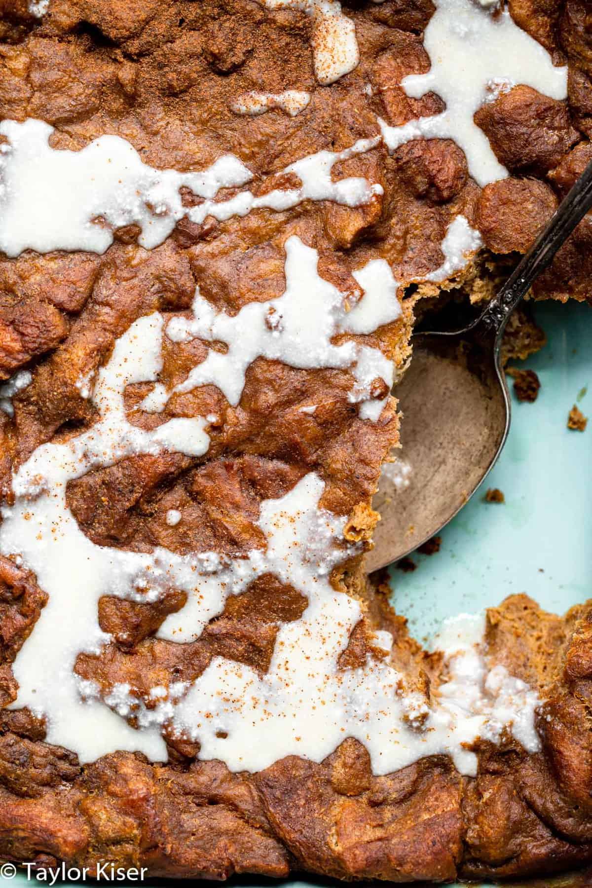 close up of baked pumpkin french toast casserole in a blue dish