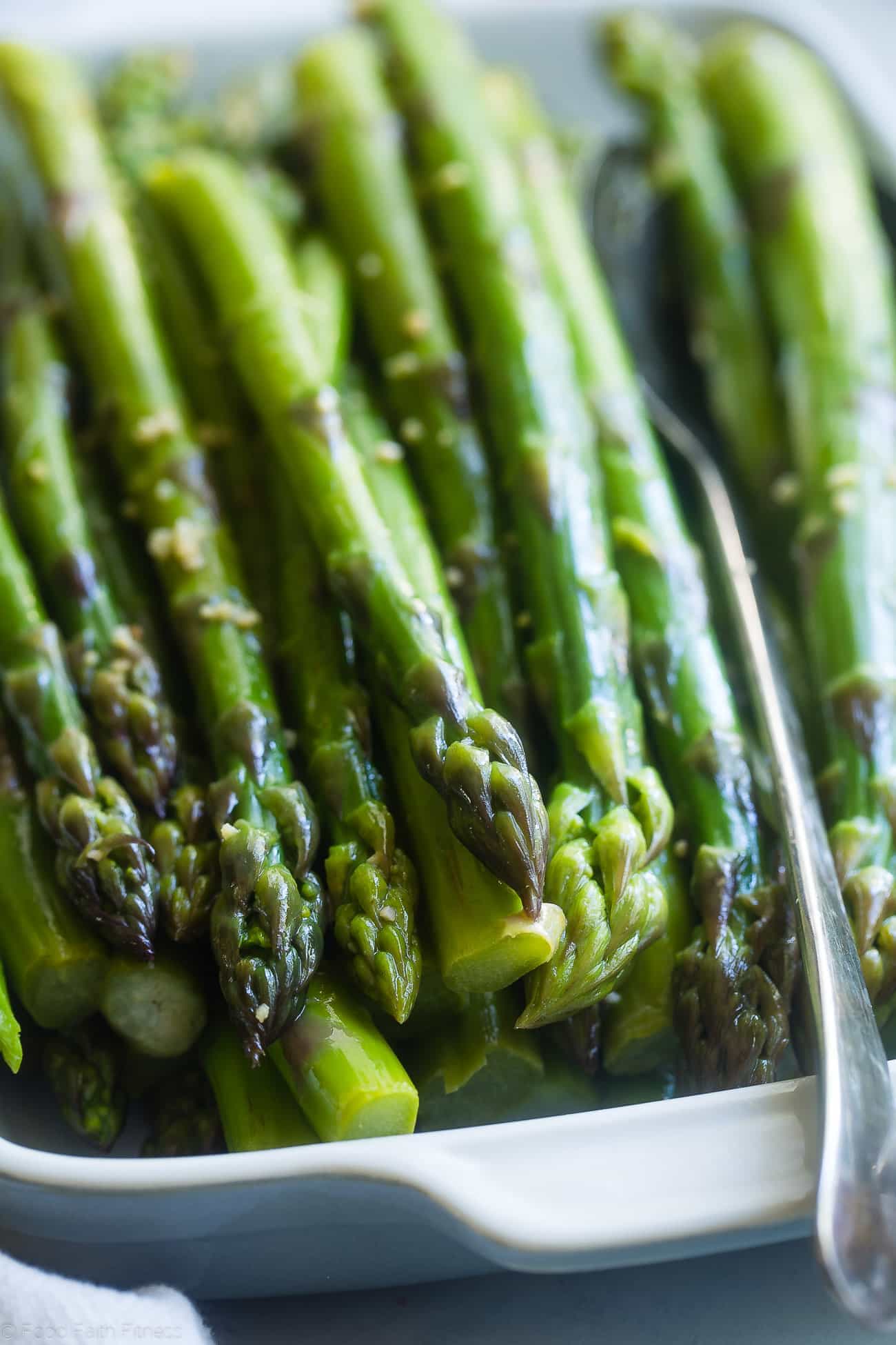 Close-up photograph of blanched asparagus. Recipe on foodfaithfitness.com