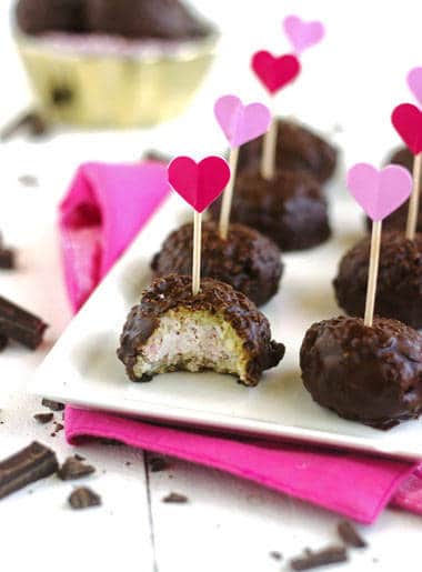 Raspberry Cheesecake Stuffed Coconut Quinoa Bites with Dark Chocolate Glaze {Gluten free} - Food Faith Fitness
