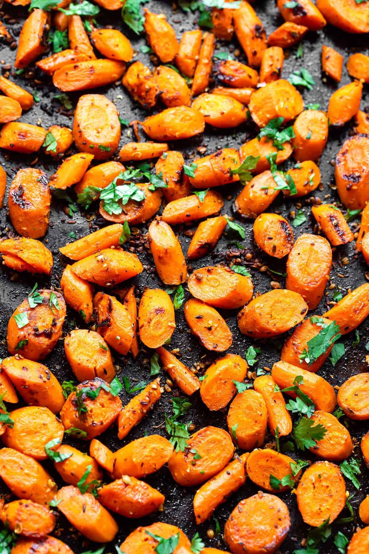 Cumin Roasted Carrots - These easy Roasted Carrots are roasted in coconut oil and delicious spices for an easy, healthy side dish that is naturally gluten free, vegan and paleo! | #Foodfaithfitness | #glutenfree #paleo #vegan #whole30 Indian Carrots