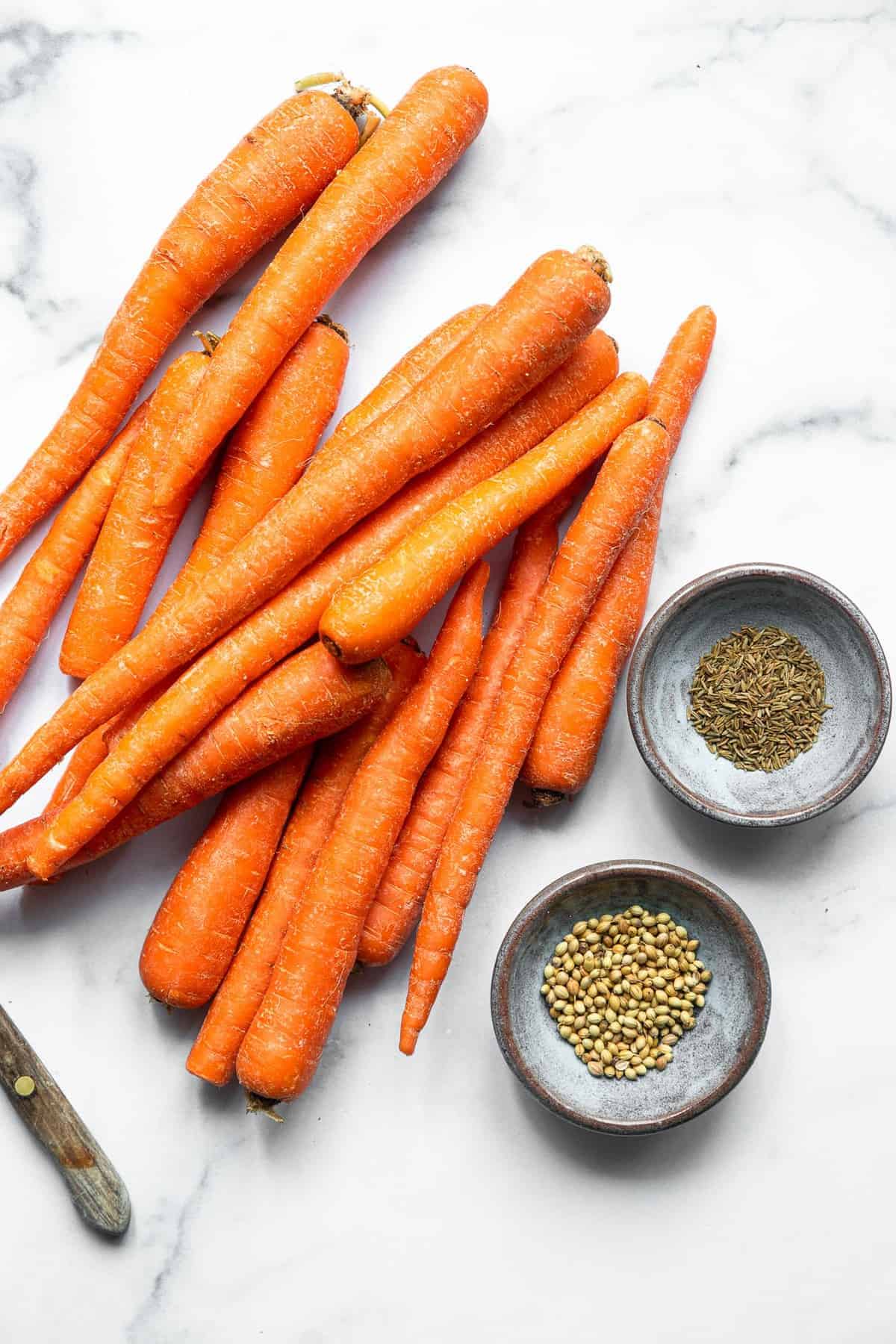Cumin Roasted Carrots - These easy Roasted Carrots are roasted in coconut oil and delicious spices for an easy, healthy side dish that is naturally gluten free, vegan and paleo! | #Foodfaithfitness | #glutenfree #paleo #vegan #whole30 Indian Carrots