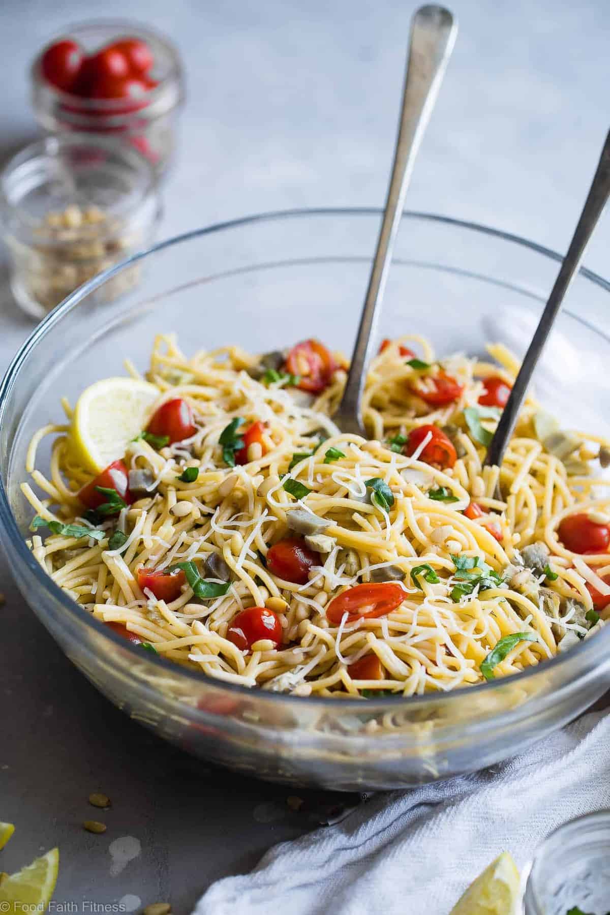Vegan Gluten Free Pasta Salad- A simple, healthy, vegan friendly pasta salad with creamy, roasted artichokes, bright fresh basil, garlic and lemon vinaigrette! Big flavors, so easy and great for Spring or Potlucks! | #Foodfaithfitness | #Vegan #Glutenfree #Healthy #Pastasalad #Dairyfree