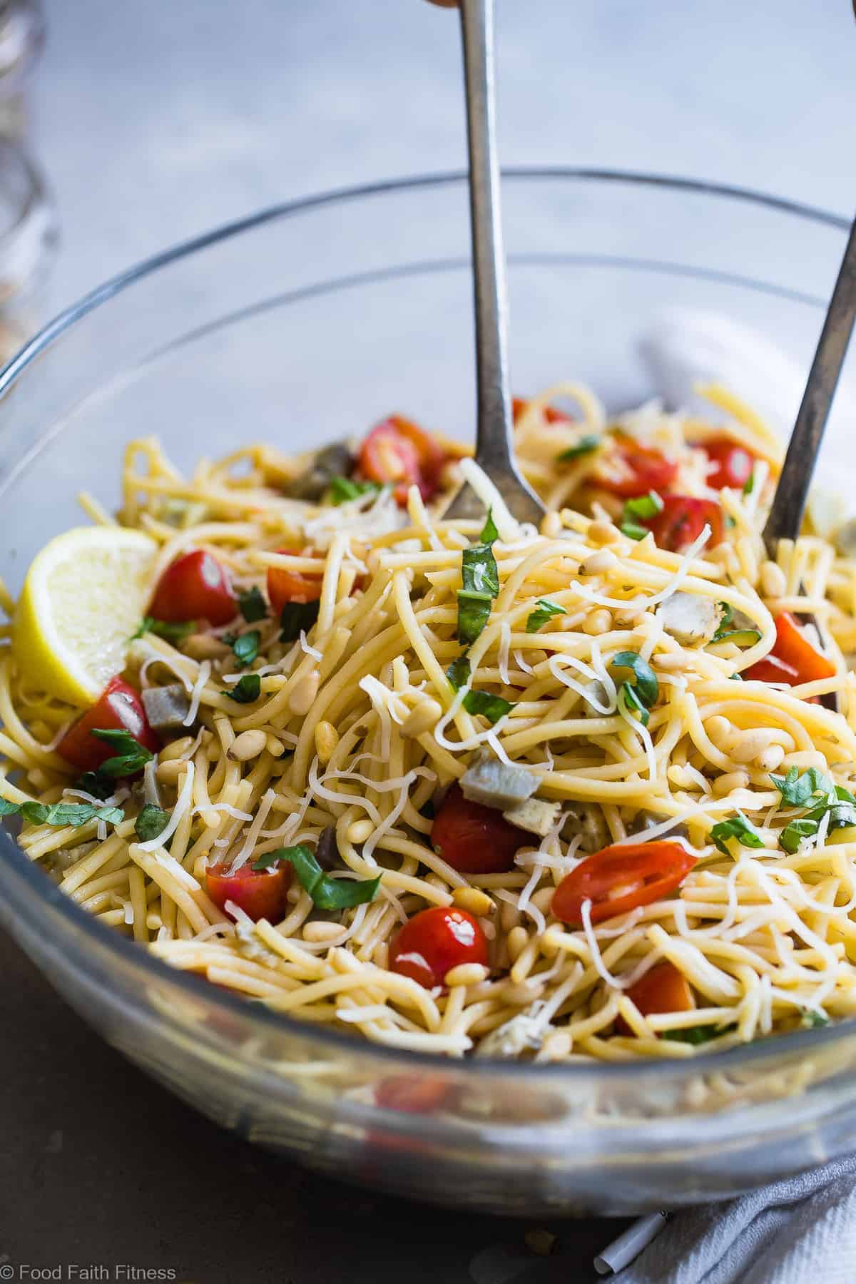 Gluten Free Lemon Artichoke Spaghetti Pasta Salad- A simple, healthy, vegan friendly pasta salad with creamy, roasted artichokes, bright fresh basil, garlic and lemon vinaigrette! Big flavors, so easy and great for Spring or Potlucks! | #Foodfaithfitness | #Vegan #Glutenfree #Healthy #Pastasalad #Dairyfree