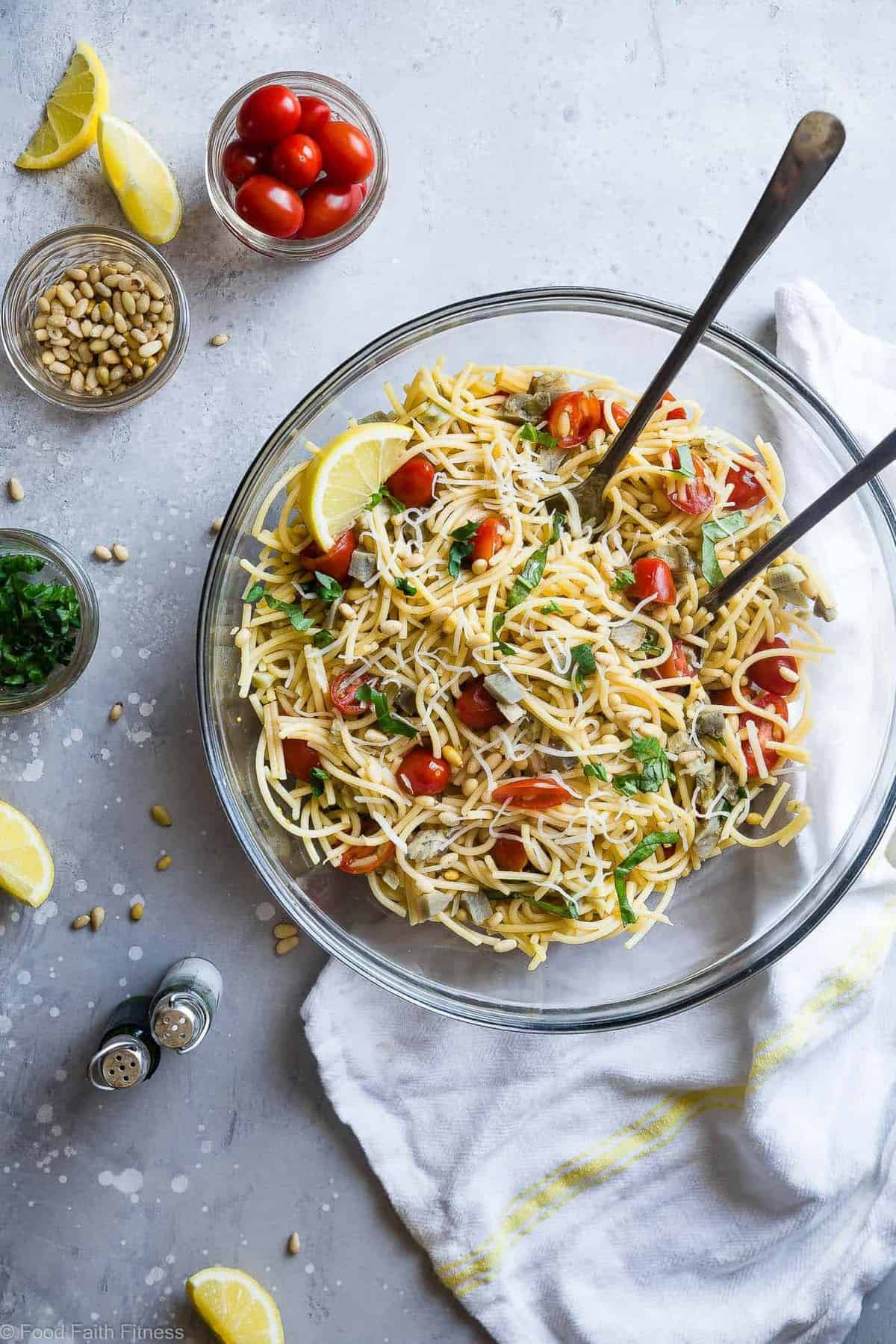 Gluten Free Lemon Artichoke Spaghetti Pasta Salad- A simple, healthy, vegan friendly pasta salad with creamy, roasted artichokes, bright fresh basil, garlic and lemon vinaigrette! Big flavors, so easy and great for Spring or Potlucks! | #Foodfaithfitness | #Vegan #Glutenfree #Healthy #Pastasalad #Dairyfree