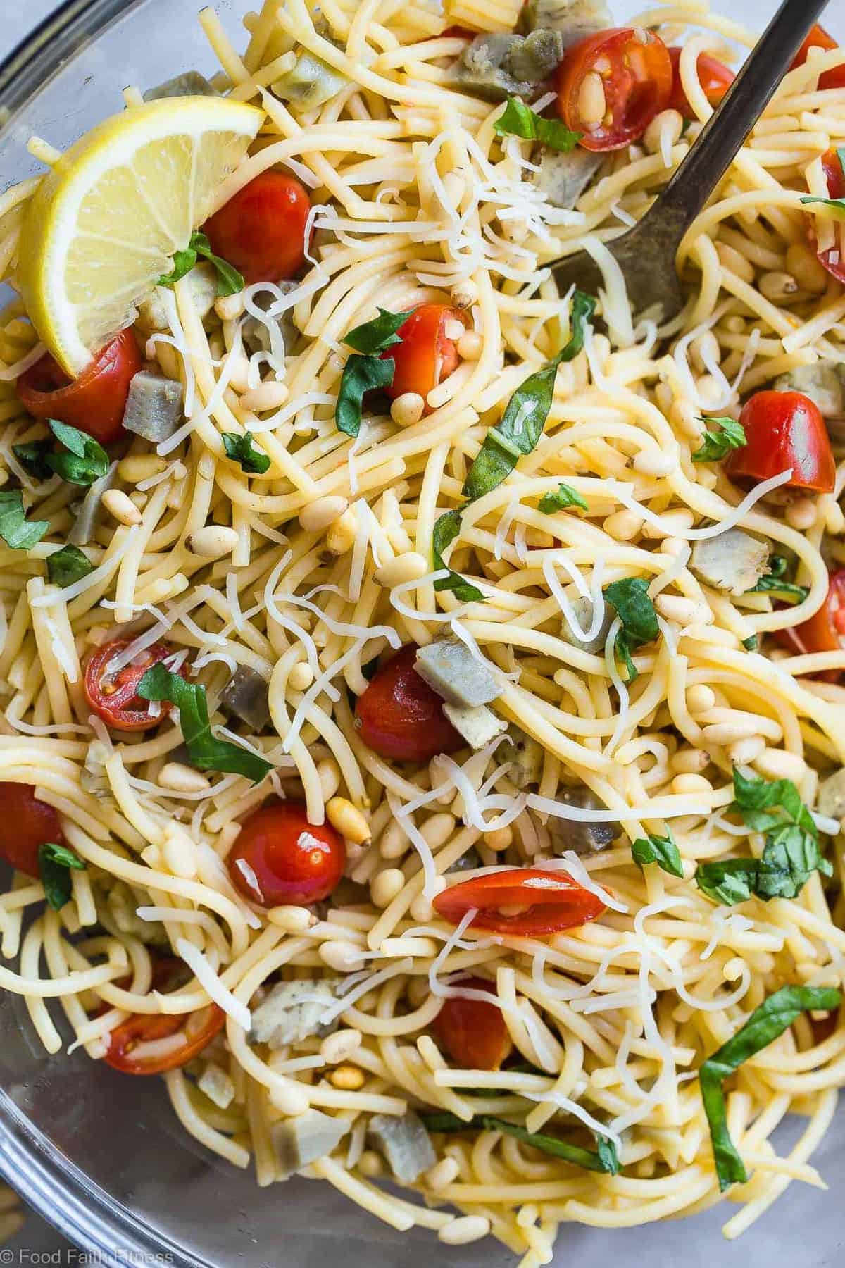 Vegan Gluten Free Pasta Salad- A simple, healthy, vegan friendly pasta salad with creamy, roasted artichokes, bright fresh basil, garlic and lemon vinaigrette! Big flavors, so easy and great for Spring or Potlucks! | #Foodfaithfitness | #Vegan #Glutenfree #Healthy #Pastasalad #Dairyfree