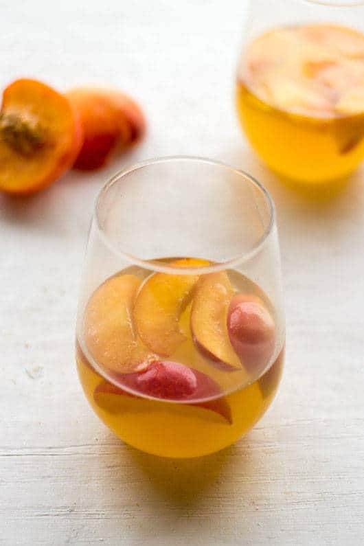 White Wine Cocktail with Peaches and Honey Fig Syrup