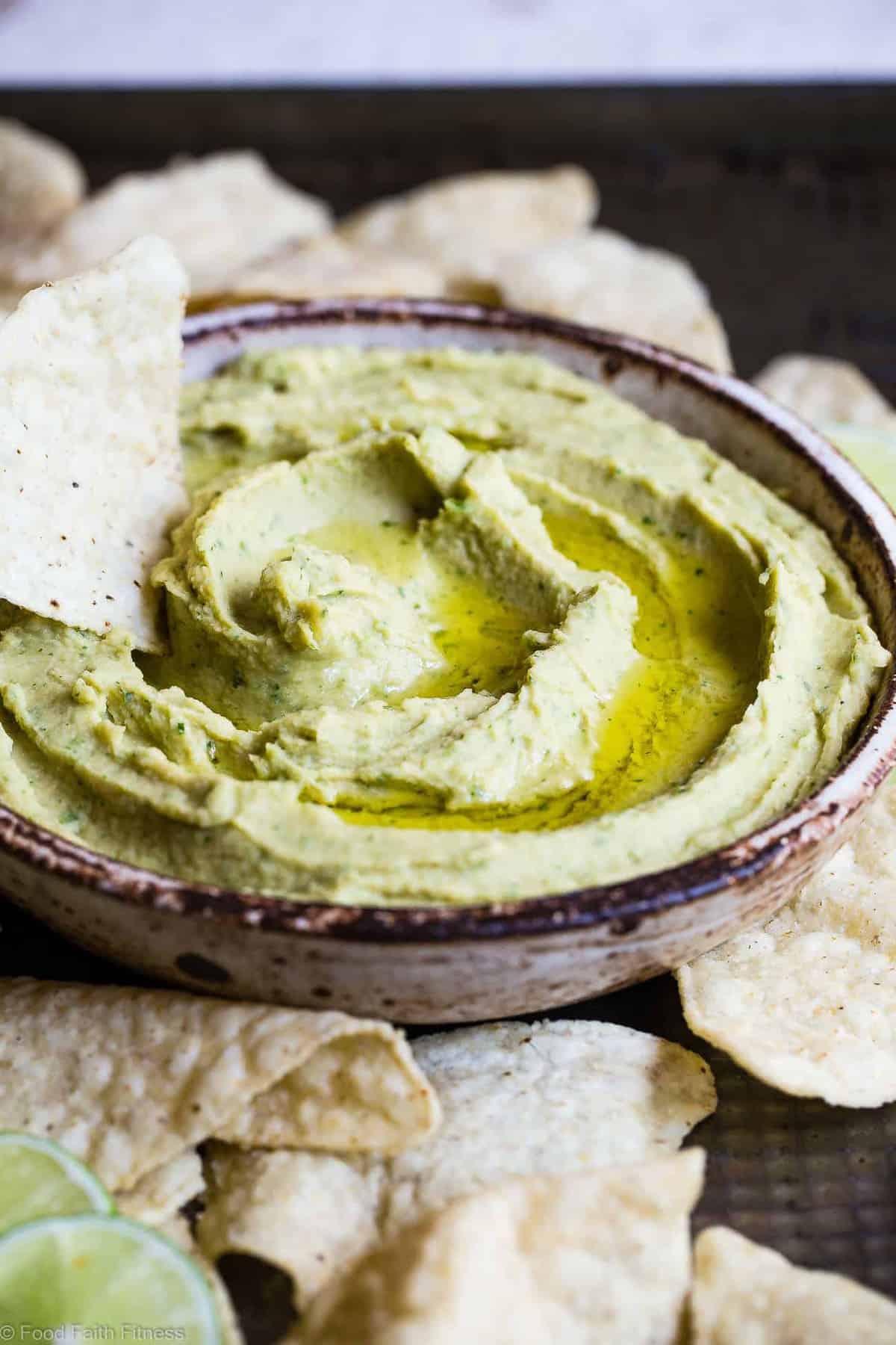 Cilantro Lime Jalapeno Hummus - This spicy, ADDICTING homemade spicy hummus recipe doesn't use tahini so it's SO easy to make! Perfect for snacks, or spreading on a sandwich and gluten free, vegan and healthy too! | #Foodfaithfitness | #Vegan #Glutenfree #Healthy #Dairyfree #Hummus