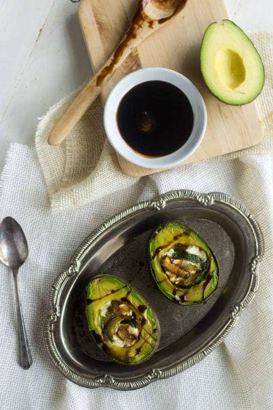 Zucchini and Goat Cheese Stuffed Balsamic Avocados - A quick, easy and healthy snack! - Food Faith Fitness | #healthysnack #avocado #glutenfree