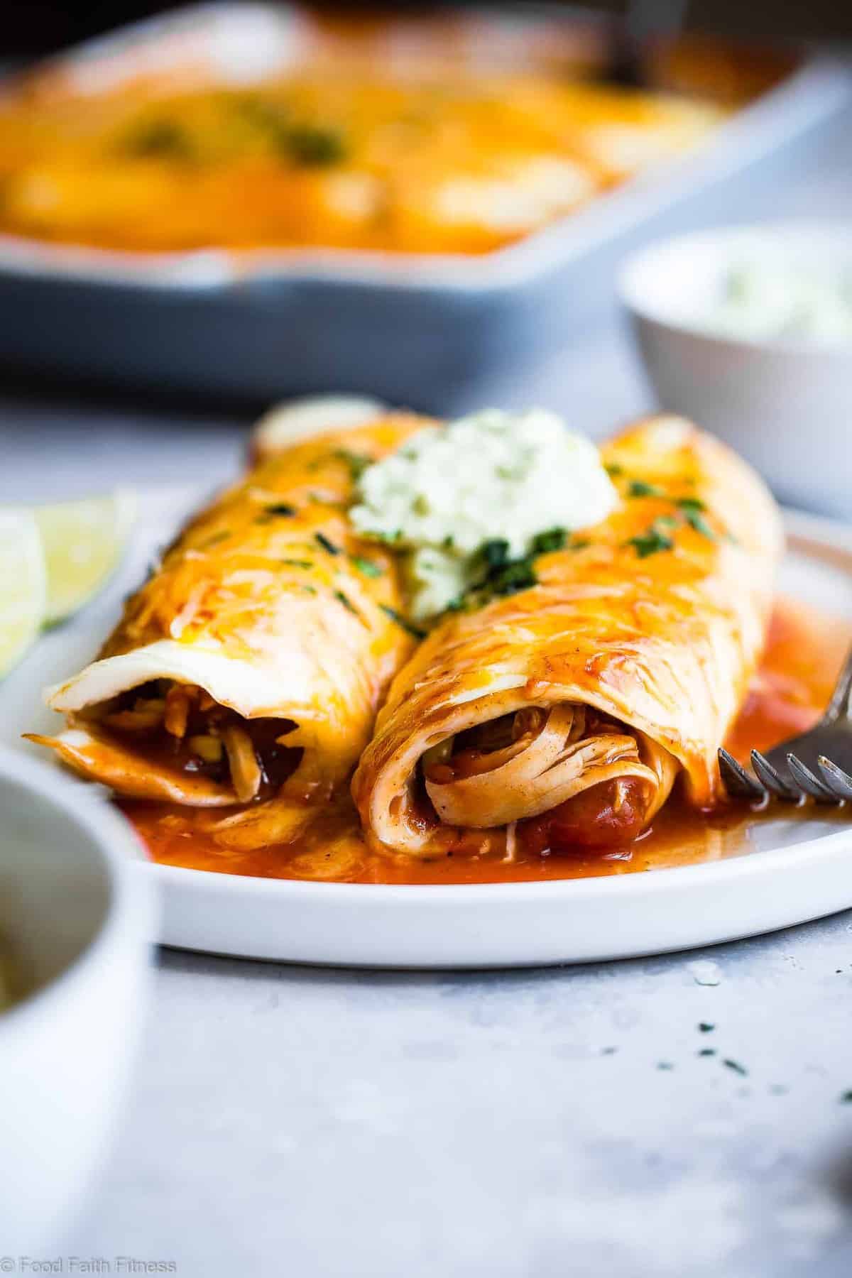 Healthy Low Carb Chicken Enchiladas - This gluten free Healthy Low Carb Chicken Enchilada Recipe uses a secret ingredient to make it low carb, protein PACKED and under 500 calories for a HUGE serving! These do NOT taste healthy and even picky eaters love them! | #Foodfaithfitness | #Lowcarb #Glutenfree #Healthy #Grainfree #Enchiladas 