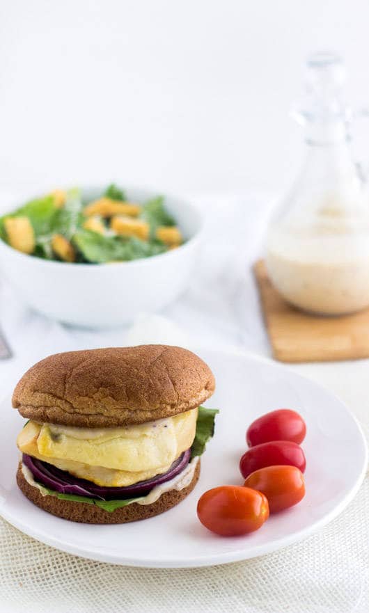 Chicken Caesar Burgers - Like a salad on a bun. Easy, healthy and cheesy! | foodfaithfitness.com | #chicken #burger #recipe