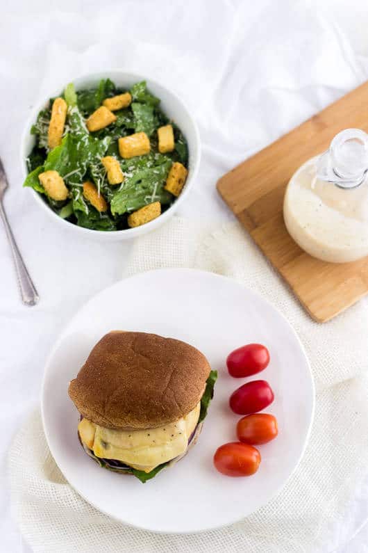 Caesar Grilled Chicken Burger - Ever wondered how to make chicken burgers at home? These taste like a salad on a bun. Easy, healthy, cheesy and only 350 calories and protein packed! | foodfaithfitness.com | @FoodFaithFit