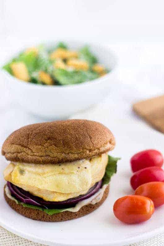 Caesar Grilled Chicken Burger - Like a salad on a bun. Easy, healthy, cheesy and only 350 calories and protein packed! | foodfaithfitness.com | @FoodFaithFit