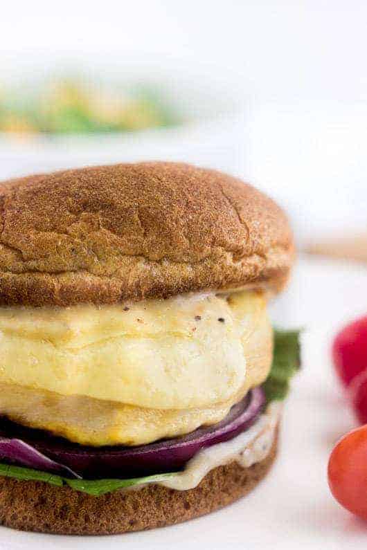 Caesar Grilled Chicken Burger - These chicken burgers taste like a salad on a bun. Easy, healthy, cheesy and only 350 calories and protein packed! | foodfaithfitness.com | @FoodFaithFit