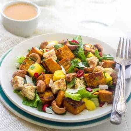 Curried Sweet Potato and Mango Salad - Sweet coconut and mango, and spicy curry roasted sweet potatoes and cashews, this salad has it all! | Foodfaithfitness.com | #glutenfree #salad #recipe