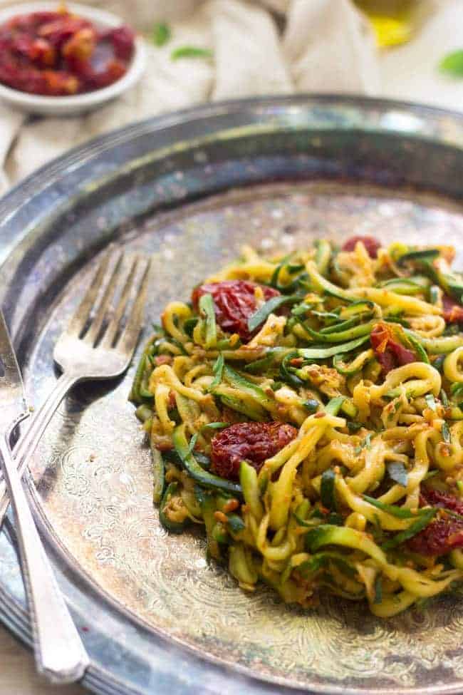 Raw Sundried Tomato Sauce with Zucchini Noodles - An easy meal that is big on flavor, but not on calories! | Foodfaithfitness.com | #raw #vegan #recipe #zucchinoodles