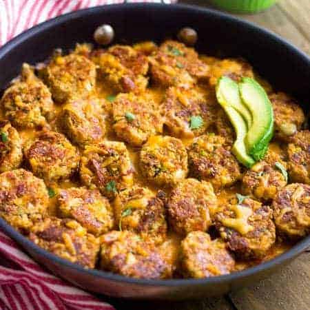 Mexican Cauliflower Tater tot Casserole - So ooey, gooey and cheesy you would never know it's #lowcarb and #healthy! | Foodfaithfitness.com | #recipe #gameday #cauliflower