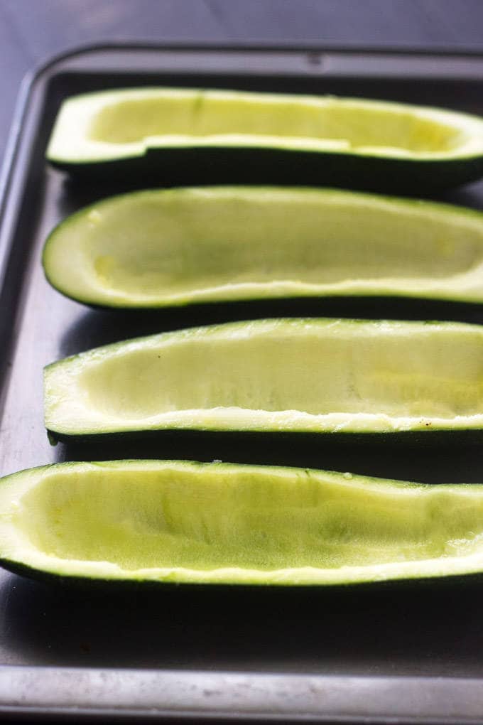 Mexican Stuffed Zucchini with Avocado Salsa - SO yummy, healthy and great for school nights! | Foodfaithfitness.com | #glutenfree #lowcarb #recipe #zucchini