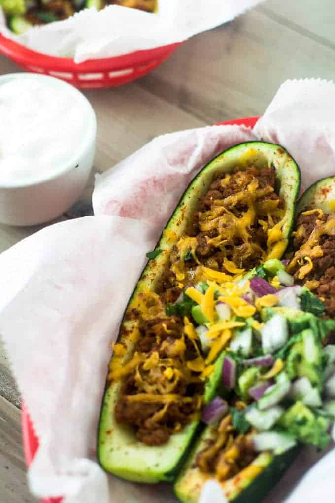 Mexican Stuffed Zucchini with Avocado Salsa - SO yummy, healthy and great for school nights! | Foodfaithfitness.com | #glutenfree #lowcarb #recipe #zucchini