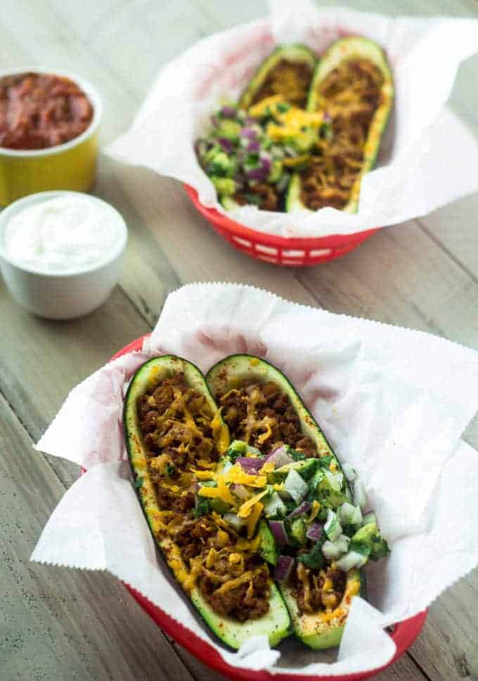 Mexican Stuffed Zucchini with Avocado Salsa - SO yummy, healthy and great for school nights! | Foodfaithfitness.com | #glutenfree #lowcarb #recipe #zucchini