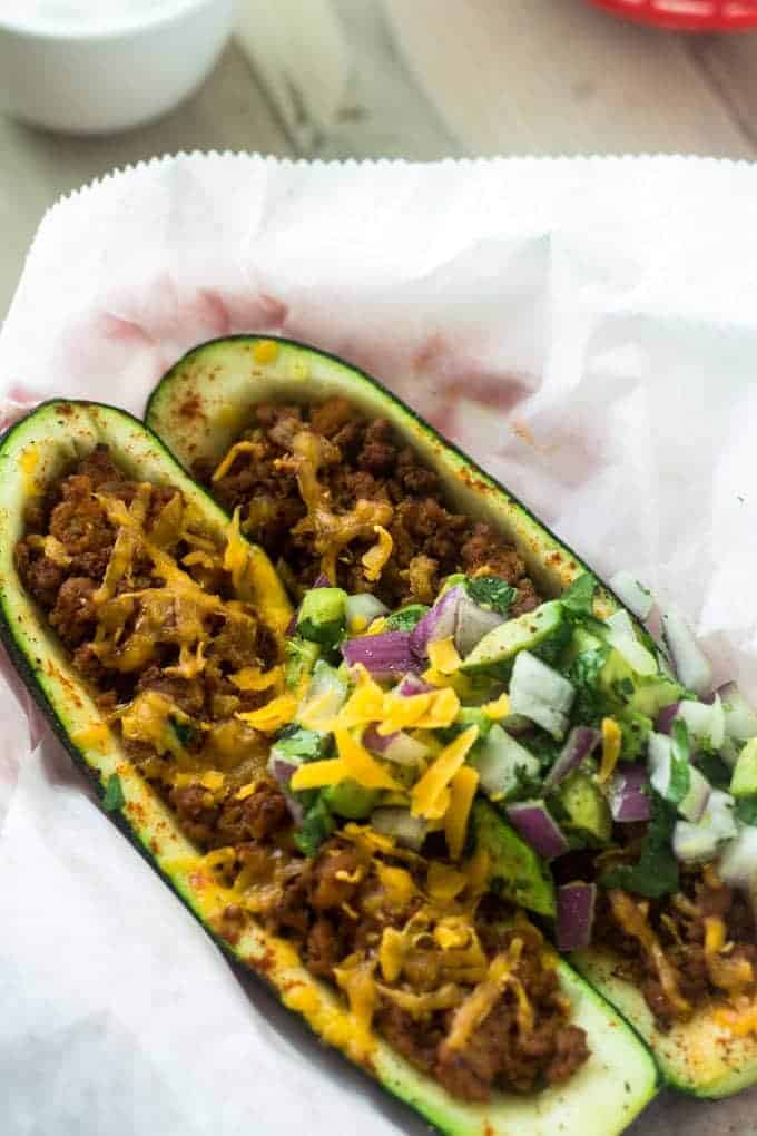 Mexican Stuffed Zucchini with Avocado Salsa - SO yummy, healthy and great for school nights! | Foodfaithfitness.com | #glutenfree #lowcarb #recipe #zucchini