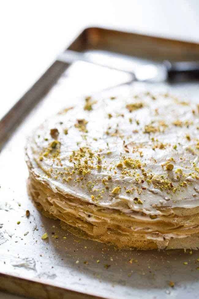 Coconut Pistachio Crepe Cake - A showstopping dessert that is surprisingly EASY! Perfect to impress at your Christmas table! | Foodfaithfitness.com | #recipe
