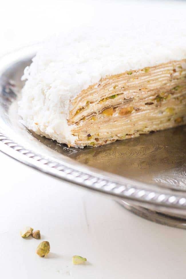 Coconut Pistachio Crepe Cake - A showstopping dessert that is surprisingly EASY! Perfect to impress at your Christmas table! | Foodfaithfitness.com | #recipe