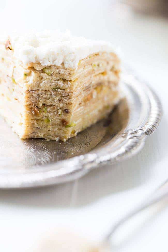 Coconut Pistachio Crepe Cake - A showstopping dessert that is surprisingly EASY! Perfect to impress at your Christmas table! | Foodfaithfitness.com | #recipe