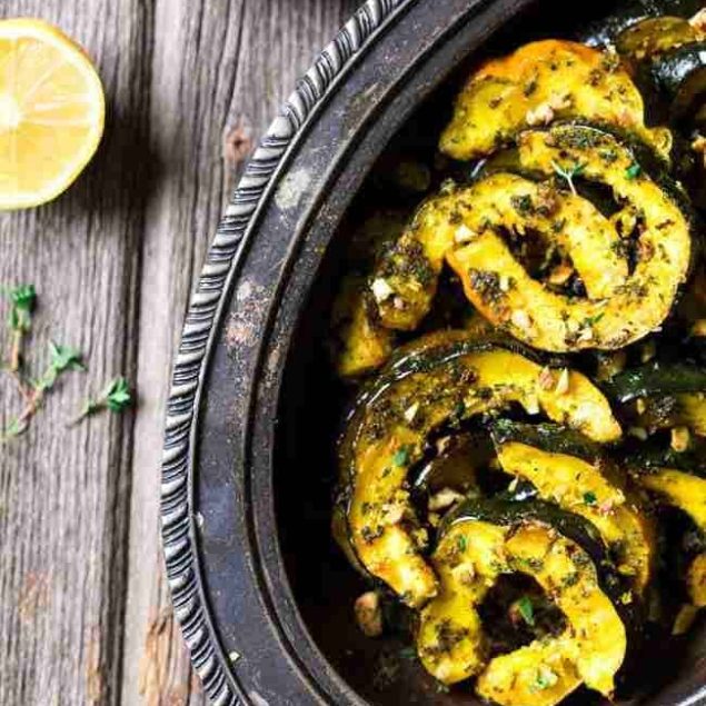 Pamesan Toasted Acorn Squash with Sage Kale Pesto - An easy side dish that is perfect for entertaining or a weeknight dinner! | Foodfaithfitness.com | #recipe