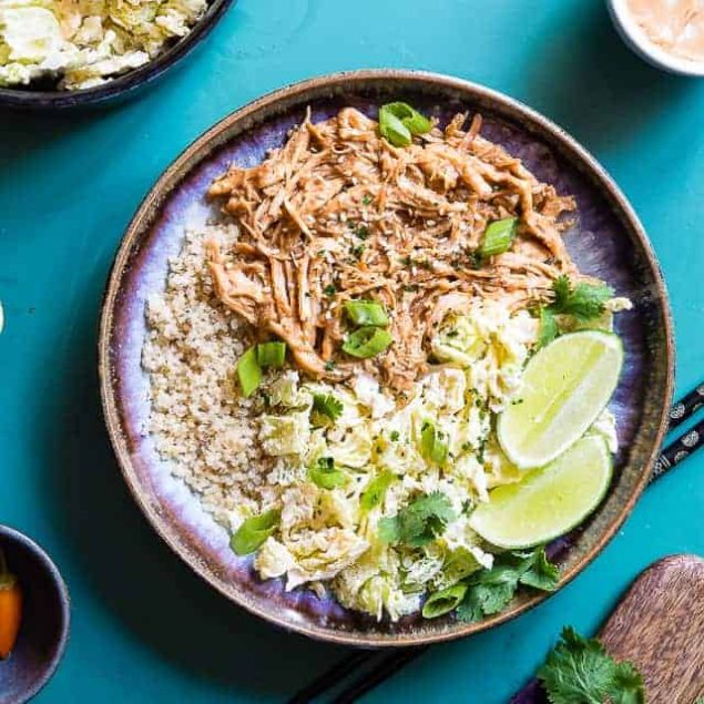 Slow Cooker Thai Peanut Chicken Quinoa Bowls - CREAMY crockpot Thai peanut chicken is mixed with quinoa and a spicy cabbage slaw to make a family friendly, gluten free and healthy meal! The slow cooker does the work for you! | #Foodfaithfitness | #Glutenfree #Dairyfree #Healthy #Slowcooker #Crockpot