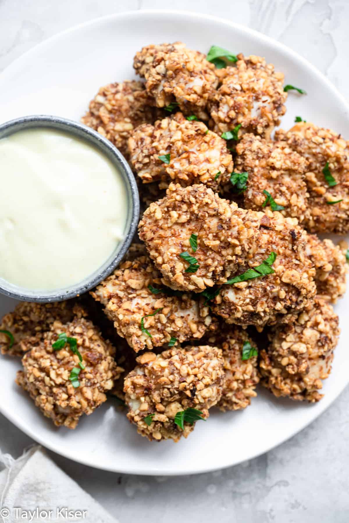 Low Carb Almond Crusted Chicken Bites - These Chicken Bites only take 20 minutes, and use 6 ingredients. They're baked, not fried, served with a healthy honey mustard dip and are a healthy dinner for the whole family! | #Foodfaithfitness | #Glutenfree #lowcarb #healthy #kidfriendly #dairyfree