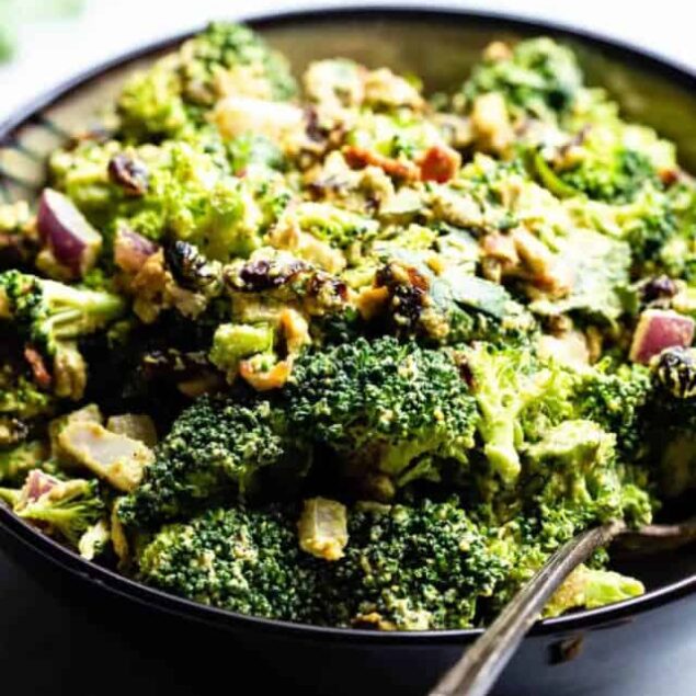 Curried Vegan Paleo Broccoli Cashew Salad -  This easy healthy broccoli salad is jazzed up with a curried cashew cream dressing. It's a quick, easy, gluten and dairy free side that's always a crowd pleaser! | #Foodfaithfitness | #Glutenfree #Paleo #Vegan #Dairyfree #Healthy