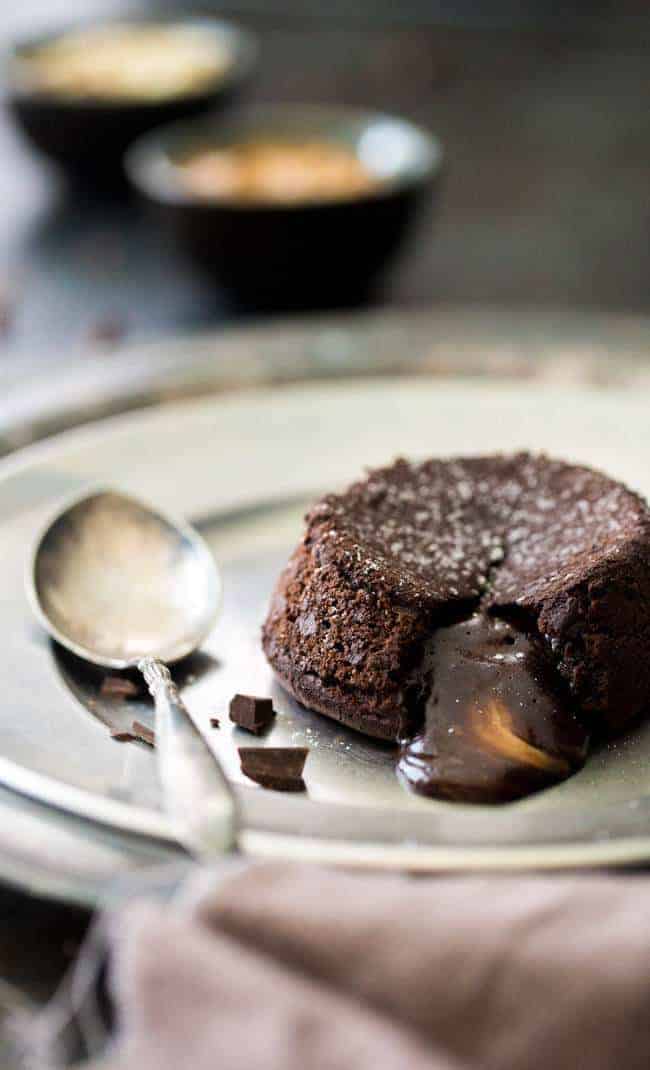 Paleo Chocolate Lava Cake Recipe - So rich and chocolatey that you would NEVER know these are healthy! They’re made with coconut oil and almond butter, so they taste like an Almond Joy bar! Perfect for Valentine’s Day! | Foodfaithfitness.com |