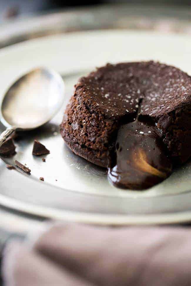 Paleo Chocolate Lava Cake Recipe - So rich and chocolatey that you would NEVER know these are healthy! They’re made with coconut oil and almond butter, so they taste like an Almond Joy bar! Perfect for Valentine’s Day! | Foodfaithfitness.com |