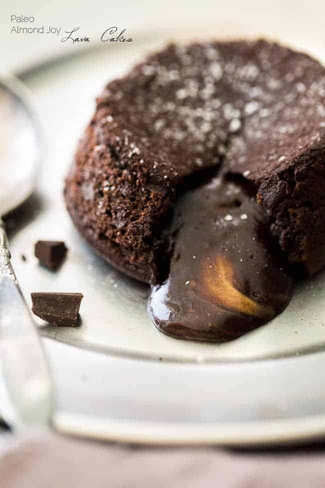 Paleo Chocolate Lava Cake Recipe - So rich and chocolatey that you would NEVER know these are healthy! They’re made with coconut oil and almond butter, so they taste like an Almond Joy bar! Perfect for Valentine’s Day! | Foodfaithfitness.com |