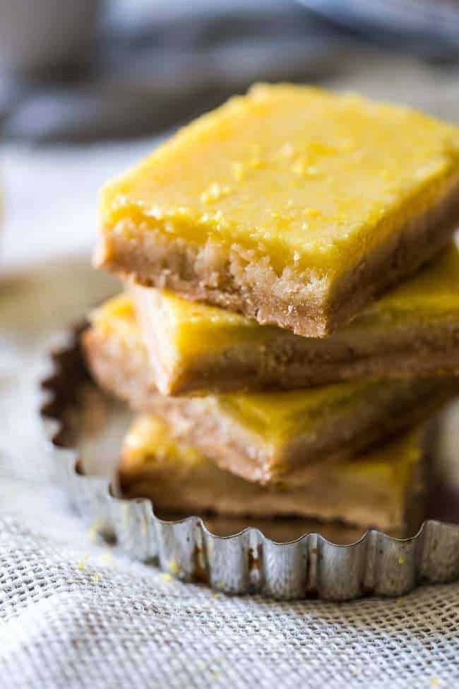 Paleo Lemon Bars - A healthy, grain/refined sugar free remake of the classic! SO easy and only 5 ingredients! | Foodfaithfitness.com | @FoodFaithFit