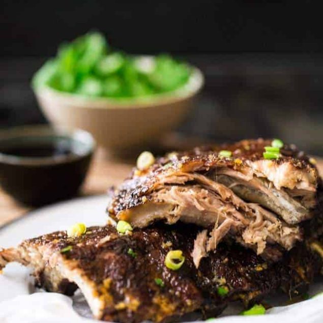 Paleo 5 Spice Honey Garlic Oven Baked Ribs - Sticky, sweet, healthier ribs that are gluten free, Paleo and made in the oven. These fall RIGHT OFF THE BONE! | Foodfaithfitness.com | @FoodFaithFit