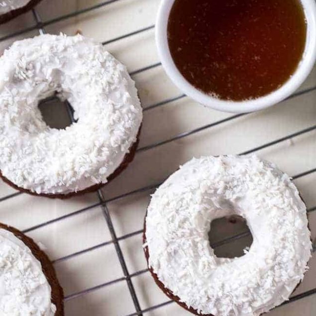 Gluten Free Carrot Cake Baked Donuts - Made in one bowl, healthy and Paleo friendly! Coconut cream frosting add the perfect, Easter touch! | Foodfaithfitness.com | @FoodFaithFit