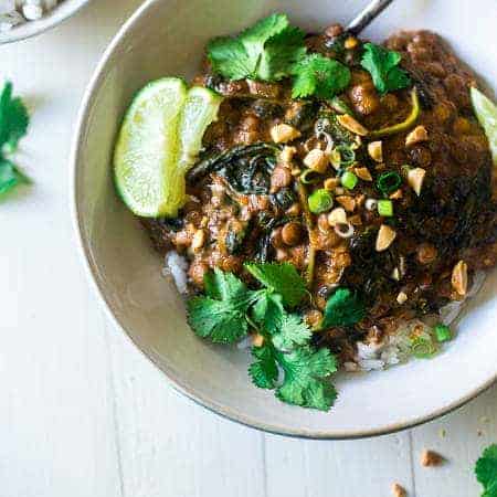 One-Pot Creamy Spinach Lentils - These Thai-style lentils are stewed in creamy peanut butter and coconut milk. They're a vegetarian, one pot wonder that is perfect for Meatless Monday! | Foodfaithfitness.com | @FoodFaithFit