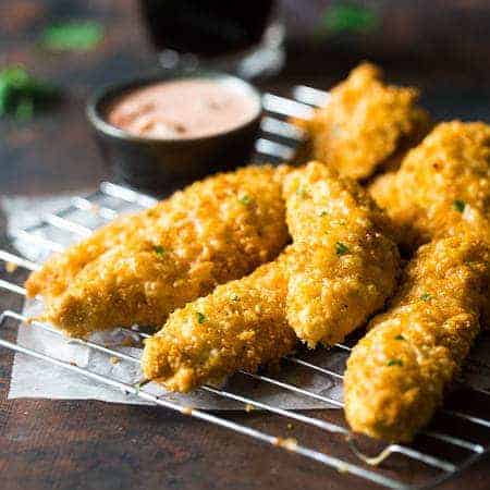 Cheesy Mexican Baked Chicken Tenders with Couscous Crust - It only takes 5 ingredients to make this super easy, healthy meal that the whole family will love! | Foodfaithfitness.com | @Foodfaithfit