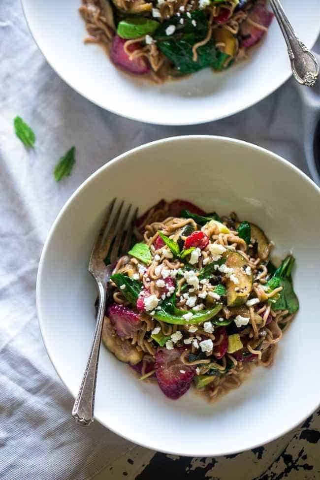 Spring Time Healthy Pasta Salad - This pasta salad is made with tofu noodles, strawberries, avocado, zucchini and balsamic vinaigrette for an easy, vegetarian meal. Perfect for spring parties! | Foodfaithfitness.com | @FoodFaithFit