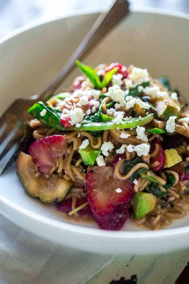 Spring Time Healthy Pasta Salad - This pasta salad is made with tofu noodles, strawberries, avocado, zucchini and balsamic vinaigrette for an easy, vegetarian meal. Perfect for spring parties! | Foodfaithfitness.com | @FoodFaithFit