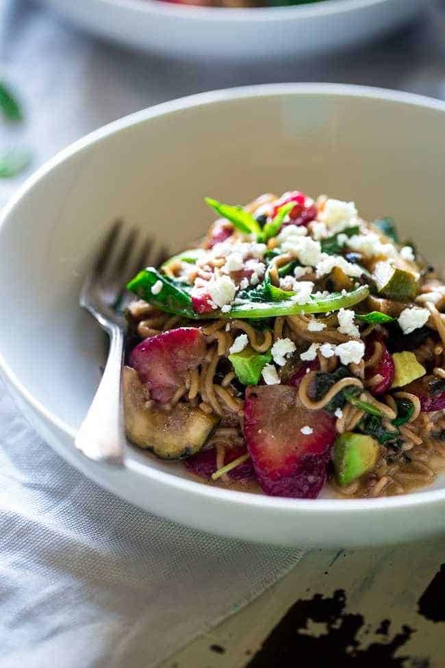 Spring Time Healthy Pasta Salad - This pasta salad is made with tofu noodles, strawberries, avocado, zucchini and balsamic vinaigrette for an easy, vegetarian meal. Perfect for spring parties! | Foodfaithfitness.com | @FoodFaithFit