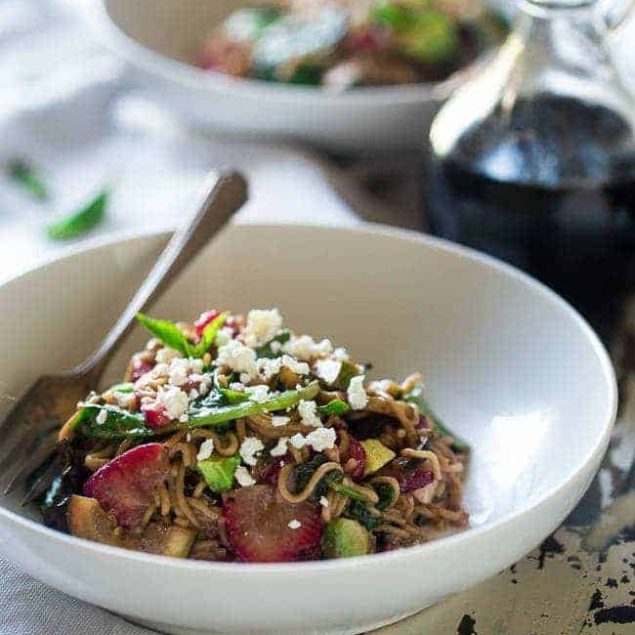 Spring Time Healthy Pasta Salad - This pasta salad is made with tofu noodles, strawberries, avocado, zucchini and balsamic vinaigrette for an easy, vegetarian meal. Perfect for spring parties! | Foodfaithfitness.com | @FoodFaithFit