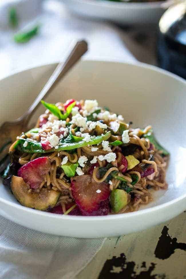 Spring Time Healthy Pasta Salad - This pasta salad is made with tofu noodles, strawberries, avocado, zucchini and balsamic vinaigrette for an easy, vegetarian meal. Perfect for spring parties! | Foodfaithfitness.com | @FoodFaithFit