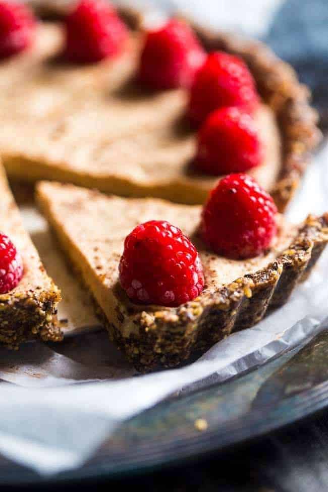 Without -baked salted chocolate cake with almond cream - this easy cake is made of almonds and data, then frozen and filled with almond cream. A healthy and gluten -free dessert that can be made in advance! | Foodfaithfitlness.com | @Foodfaithfit