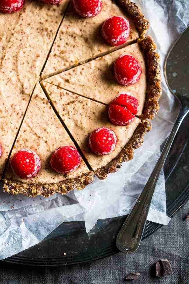 Without -baked salted chocolate cake with almond cream - this easy cake is made of almonds and data, then frozen and filled with almond cream. A healthy and gluten -free dessert that can be made in advance! | Foodfaithfitlness.com | @Foodfaithfit