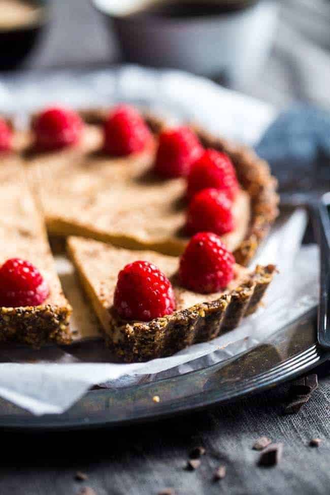 Without -baked salted chocolate cake with almond cream - this easy cake is made of almonds and data, then frozen and filled with almond cream. A healthy and gluten -free dessert that can be made in advance! | Foodfaithfitlness.com | @Foodfaithfit